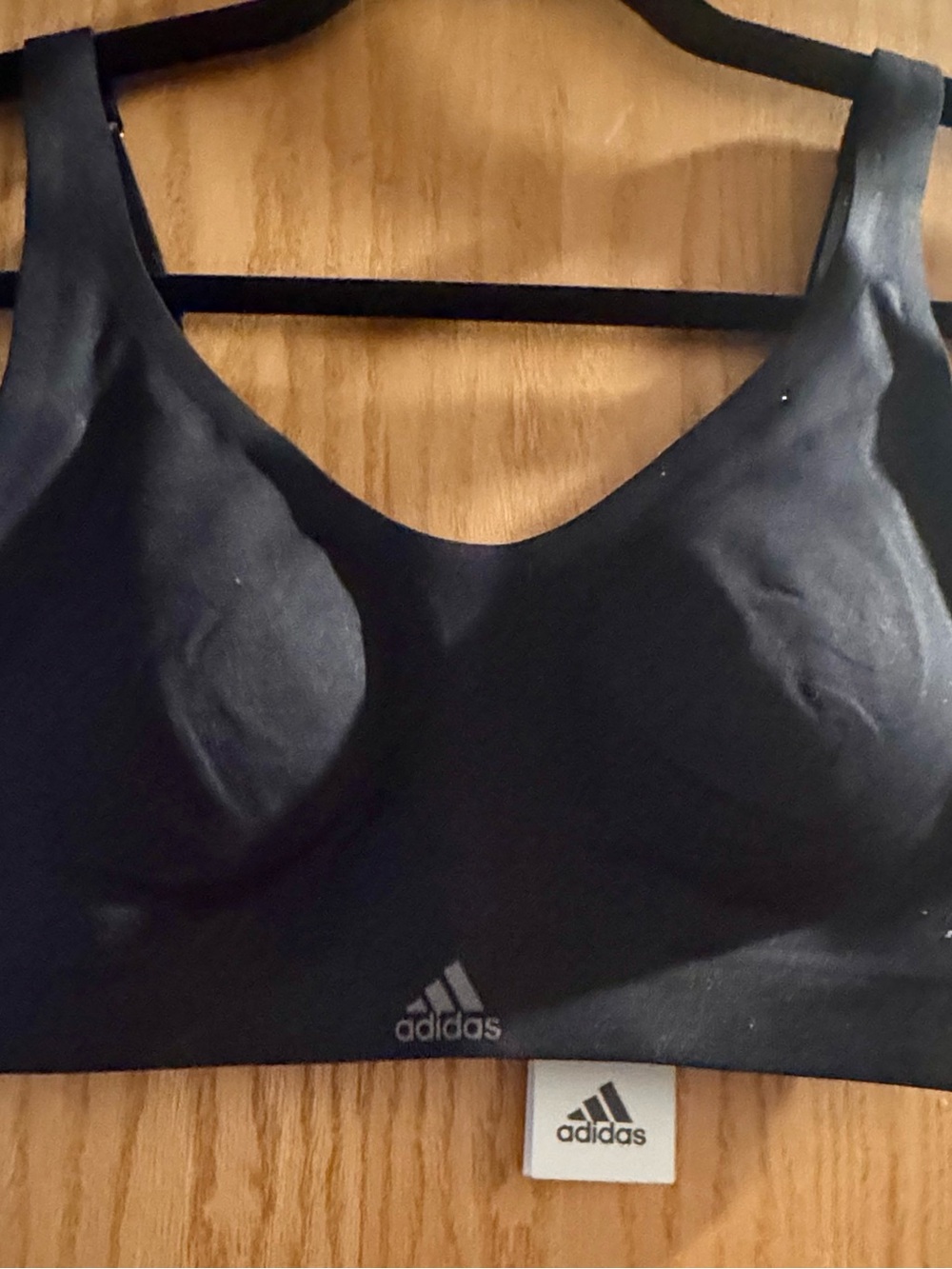 adidas Women’s Black Seamless Sports Bra - runs small along the chest.
